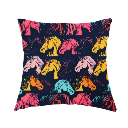 The fabric used to create this handmade cushion is a vibrant repeating pattern of stylized horse heads in teal, orange, pink, and yellow set against a dark navy blue background.
