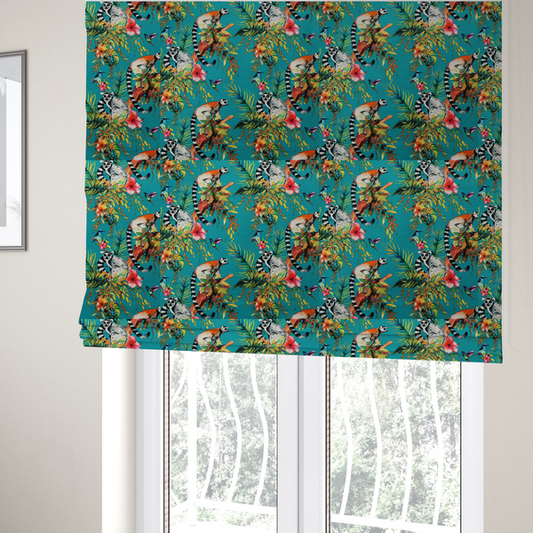 The fabric used to create these Roman blinds is a playful tropical pattern featuring ring-tailed lemurs, hummingbirds, and exotic flowers amongst lush green foliage on a bright turquoise background.