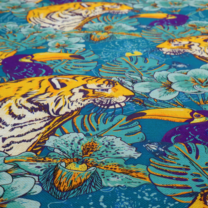 Vibrant tropical pattern featuring majestic tigers, toucans, and exotic flowers amongst lush green foliage on a bold blue background.  