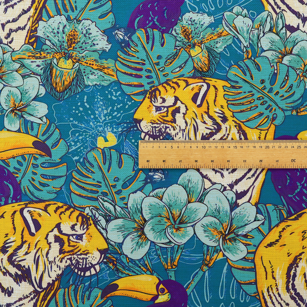 Vibrant tropical pattern featuring majestic tigers, toucans, and exotic flowers amongst lush green foliage on a bold blue background.  