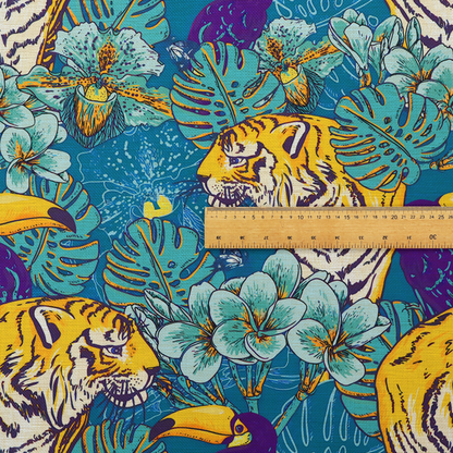Vibrant tropical pattern featuring majestic tigers, toucans, and exotic flowers amongst lush green foliage on a bold blue background.  