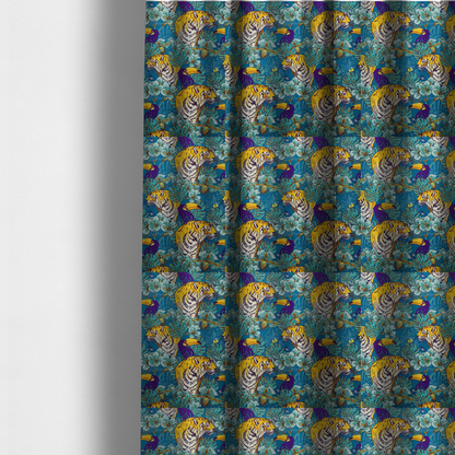 The fabric used to create these made-to-measure curtains is a vibrant tropical pattern featuring majestic tigers, toucans, and exotic flowers amongst lush green foliage on a bold blue background.  