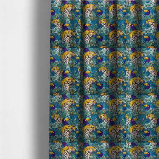 The fabric used to create these made-to-measure curtains is a vibrant tropical pattern featuring majestic tigers, toucans, and exotic flowers amongst lush green foliage on a bold blue background.  