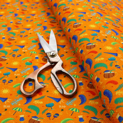 Vibrant tropical carnival pattern featuring cocktails, coconuts, maracas, suns, and festive motifs set against a bright orange background.  