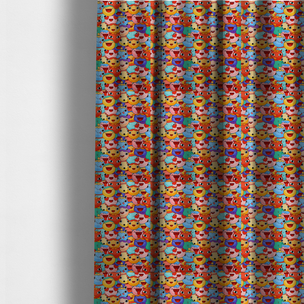 The fabric used to create these made-to-measure curtains is a dense, overlapping pattern of colourful, stylized cartoon faces featuring wide smiles, sticking-out tongues, and various cheerful or cheeky expressions in vibrant shades of pink, orange, yellow, blue, and purple.