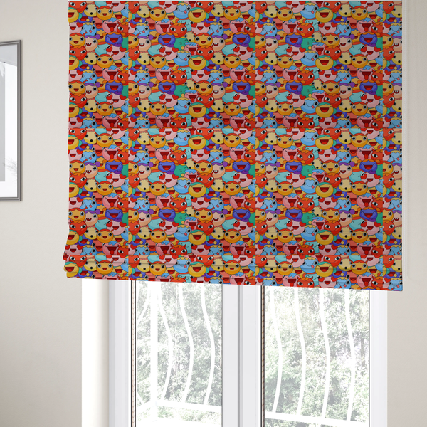 The fabric used to create these Roman blinds is a dense, overlapping pattern of colourful, stylized cartoon faces featuring wide smiles, sticking-out tongues, and various cheerful or cheeky expressions in vibrant shades of pink, orange, yellow, blue, and purple.