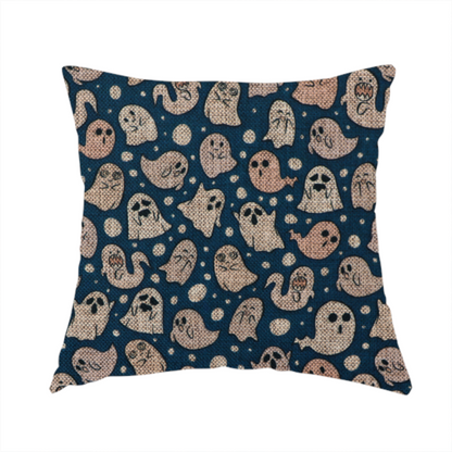 The fabric used to create this handmade cushion is a dark blue fabric patterned with an all-over, repeating design of light beige and peach cartoon ghosts with various cute and silly facial expressions, interspersed with small white polka dots.