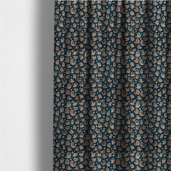 The fabric used to create these made-to-measure curtains is a dark blue fabric patterned with an all-over, repeating design of light beige and peach cartoon ghosts with various cute and silly facial expressions, interspersed with small white polka dots.