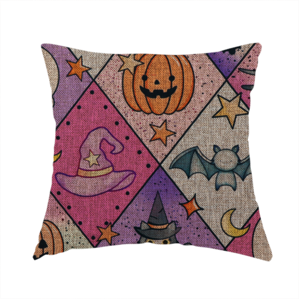 The fabric used to create this handmade cushion is a Halloween-themed harlequin pattern fabric with diamond-shaped sections in purple, pink, and beige, featuring cartoon illustrations of Jack-o'-lanterns, a witch's cat, ghosts, bats, skulls, spiders, stars, and crescent moons.