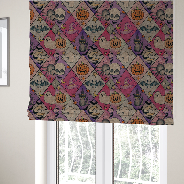 The fabric used to create these Roman blinds is a Halloween-themed harlequin pattern fabric with diamond-shaped sections in purple, pink, and beige, featuring cartoon illustrations of Jack-o'-lanterns, a witch's cat, ghosts, bats, skulls, spiders, stars, and crescent moons.