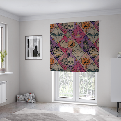 The fabric used to create these Roman blinds is a Halloween-themed harlequin pattern fabric with diamond-shaped sections in purple, pink, and beige, featuring cartoon illustrations of Jack-o'-lanterns, a witch's cat, ghosts, bats, skulls, spiders, stars, and crescent moons.