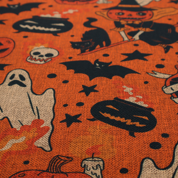 An orange Halloween fabric patterned with various black illustrations, including a witch with a pumpkin head flying on a broomstick, a black cat, ghosts, skulls, potion bottles with the text "I put a spell on you," bats, cauldrons, and stars.