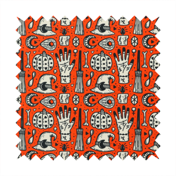 An orange Halloween fabric patterned with repeating black and white illustrations of patterned pumpkins, mystical hands with symbols, witch hats with crescent moons, brooms, candles, bones, and planchettes.
