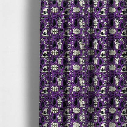 The fabric used to create these made-to-measure curtains is a purple Halloween fabric patterned with repeating black and cream illustrations of pumpkins, witch hats, black cats, mystical marked hands, snakes, keys, bones, and crystals.