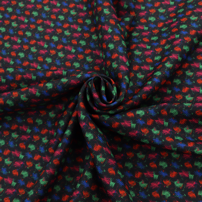 A textured tweed-style fabric featuring a dark background interwoven with dense specks of vibrant red, green, and blue flecks.