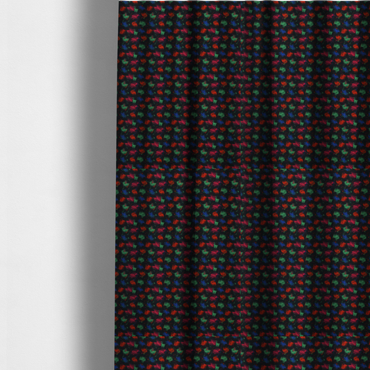 The fabric used to create these made-to-measure curtains is a textured tweed-style fabric featuring a dark background interwoven with dense specks of vibrant red, green, and blue flecks.