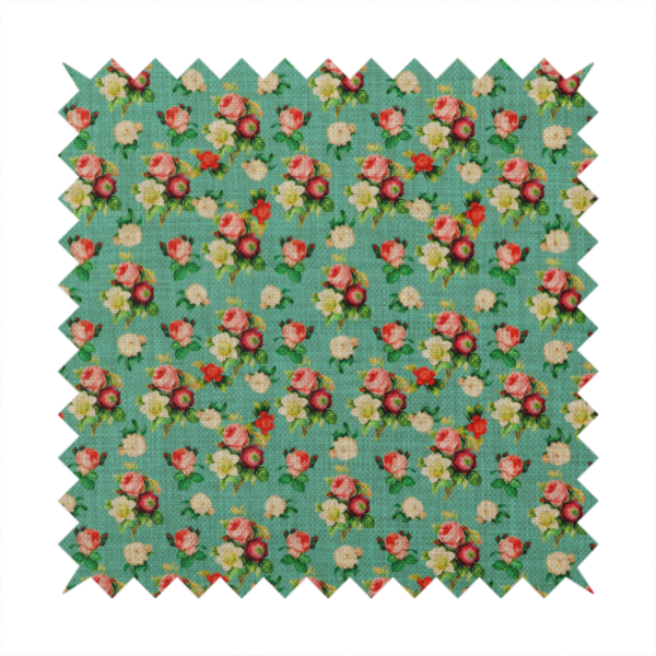 A charming repeating pattern of small bouquets featuring pink and red roses paired with white blossoms and green leaves set against a textured teal background.
