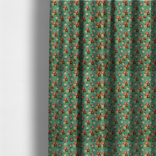 The fabric used to create these made-to-measure curtains is a charming repeating pattern of small bouquets featuring pink and red roses paired with white blossoms and green leaves set against a textured teal background.