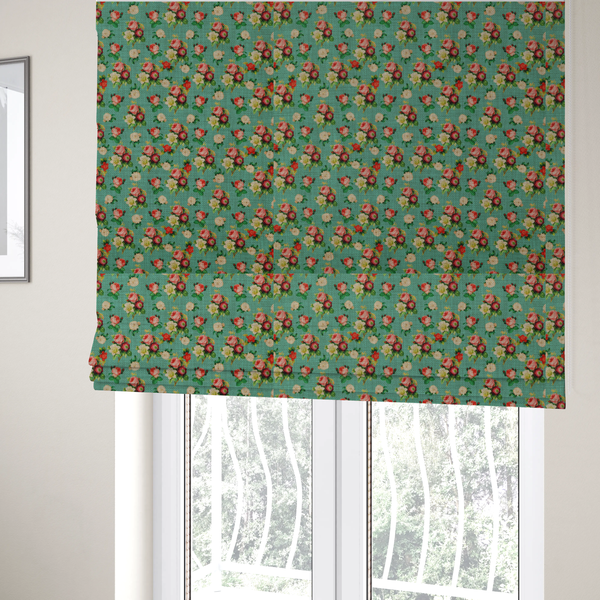 The fabric used to create these Roman blinds is a charming repeating pattern of small bouquets featuring pink and red roses paired with white blossoms and green leaves set against a textured teal background.