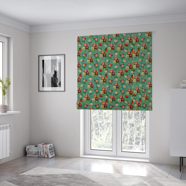 The fabric used to create these Roman blinds is a charming repeating pattern of small bouquets featuring pink and red roses paired with white blossoms and green leaves set against a textured teal background.