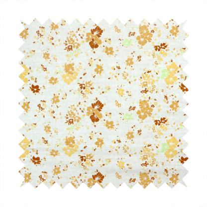 A delicate, ditsy floral repeating pattern on an off-white background featuring small clusters of flowers and leaves in shades of yellow, gold, brown, and pale green.