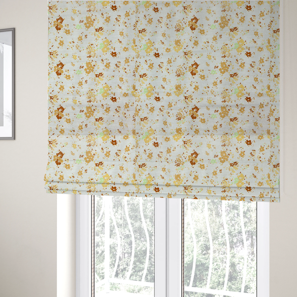 The fabric used to create these Roman blinds is a delicate, ditsy floral repeating pattern on an off-white background featuring small clusters of flowers and leaves in shades of yellow, gold, brown, and pale green.