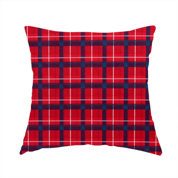 The fabric used to create this handmade cushion is a vibrant red plaid and tartan pattern featuring intersecting dark blue and white stripes over a bold red background.