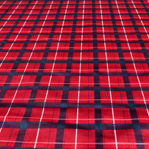 A vibrant red plaid and tartan pattern featuring intersecting dark blue and white stripes over a bold red background.