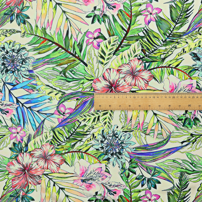 A vibrant, dense tropical pattern featuring colourful hibiscus and orchid flowers, spiky blue and white blooms, and lush green and blue palm leaves.