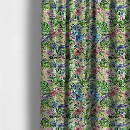 The fabric used to create these made-to-measure curtains is a vibrant, dense tropical pattern featuring colourful hibiscus and orchid flowers, spiky blue and white blooms, and lush green and blue palm leaves.