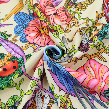 A colourful and detailed repeating pattern on a light background featuring blue and yellow birds, bright butterflies, ladybugs, and vibrant pink flowers.