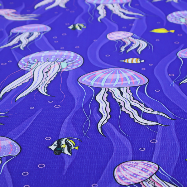 A vibrant underwater pattern on a rich blue background featuring glowing purple and pink jellyfish, tiny colourful fish, and floating bubbles.