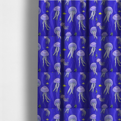 The fabric used to create these made-to-measure curtains is a vibrant underwater pattern on a rich blue background featuring glowing purple and pink jellyfish, tiny colourful fish, and floating bubbles.