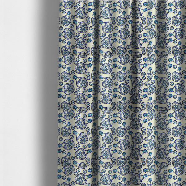 The fabric used to create these made-to-measure curtains is a repeating blue-and-white line-art pattern on a light beige background featuring glass potion bottles filled with piles of detailed eyeballs, surrounded by scattered loose eyeballs.