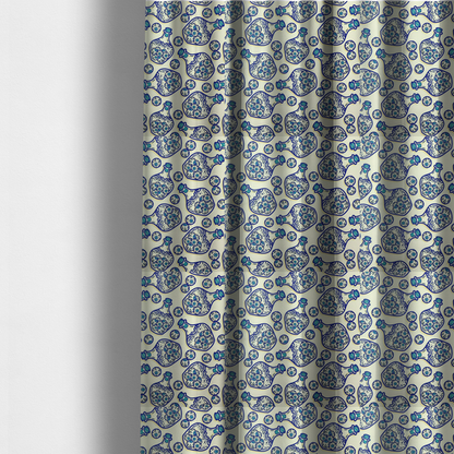 The fabric used to create these made-to-measure curtains is a repeating blue-and-white line-art pattern on a light beige background featuring glass potion bottles filled with piles of detailed eyeballs, surrounded by scattered loose eyeballs.