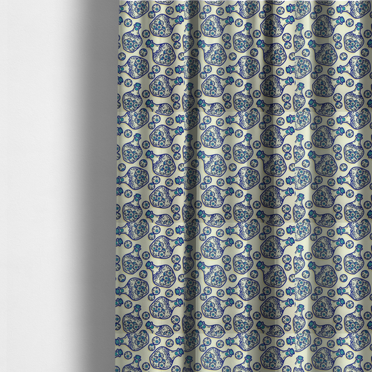 The fabric used to create these made-to-measure curtains is a repeating blue-and-white line-art pattern on a light beige background featuring glass potion bottles filled with piles of detailed eyeballs, surrounded by scattered loose eyeballs.