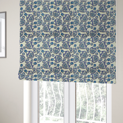 The fabric used to create these Roman blinds is a repeating blue-and-white line-art pattern on a light beige background featuring glass potion bottles filled with piles of detailed eyeballs, surrounded by scattered loose eyeballs.