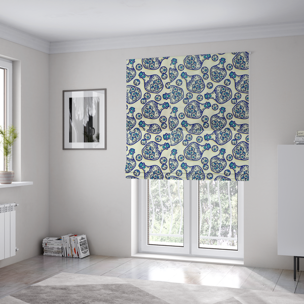 The fabric used to create these Roman blinds is a repeating blue-and-white line-art pattern on a light beige background featuring glass potion bottles filled with piles of detailed eyeballs, surrounded by scattered loose eyeballs.