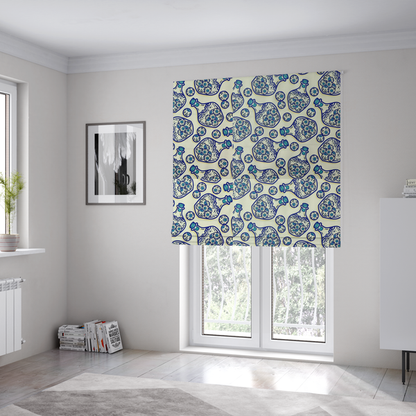 The fabric used to create these Roman blinds is a repeating blue-and-white line-art pattern on a light beige background featuring glass potion bottles filled with piles of detailed eyeballs, surrounded by scattered loose eyeballs.