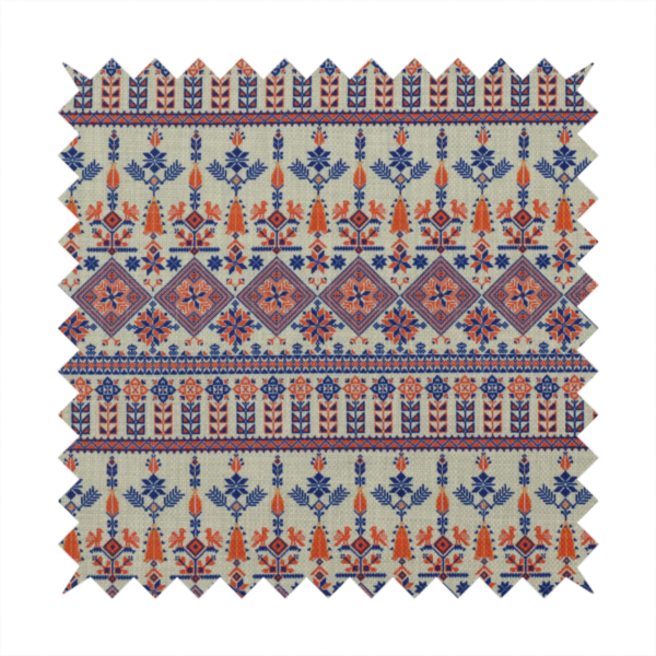 Intricate folk-inspired fabric featuring horizontal bands of geometric diamonds, stylized birds, and floral motifs in navy blue and rust orange on a beige background.