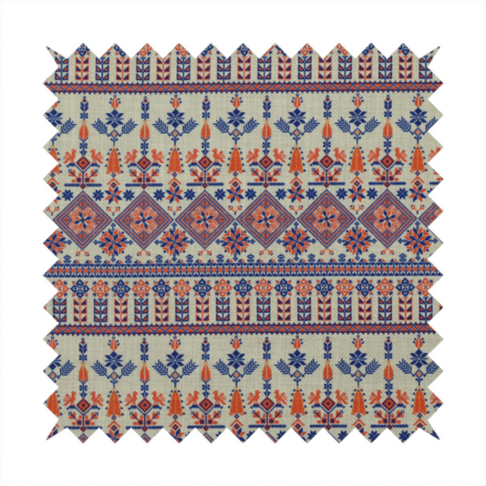 Intricate folk-inspired fabric featuring horizontal bands of geometric diamonds, stylized birds, and floral motifs in navy blue and rust orange on a beige background.