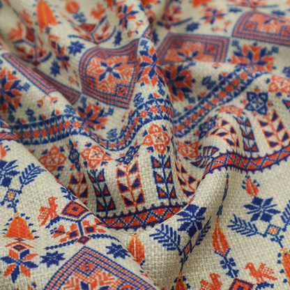 Intricate folk-inspired fabric featuring horizontal bands of geometric diamonds, stylized birds, and floral motifs in navy blue and rust orange on a beige background.