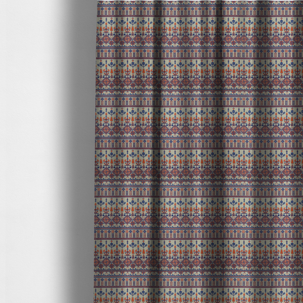 The fabric used to create these made-to-measure curtains is a intricate folk-inspired fabric featuring horizontal bands of geometric diamonds, stylized birds, and floral motifs in navy blue and rust orange on a beige background.