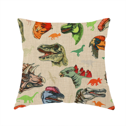 The fabric used to create this handmade cushion has several distinct dinosaur heads are scattered across the pattern, including detailed illustrations of a Triceratops with horns, a green Tyrannosaurus rex with textured skin, a long-snouted Parasaurolophus with a prominent crest, a blue-headed theropod with a pink crest, an orange-headed ceratopsian, and a Spinosaurus with a crocodile-like snout.