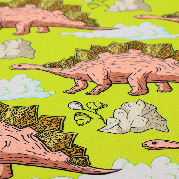 A repeating pattern on a vibrant green background featuring pink Stegosaurus dinosaurs with golden plates, interspersed with light grey rocks, fluffy white clouds, and small green sprigs.
