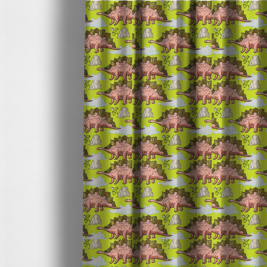 The fabric used to create these made-to-measure curtains is a repeating pattern on a vibrant green background featuring pink Stegosaurus dinosaurs with golden plates, interspersed with light grey rocks, fluffy white clouds, and small green sprigs.