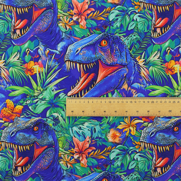 A vibrant, repeating pattern on a rich blue background featuring blue-and-purple Tyrannosaurus rex heads with open jaws and sharp teeth, surrounded by lush green tropical foliage, orange flowers, and plants.