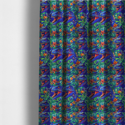 The fabric used to create these made-to-measure curtains is a vibrant, repeating pattern on a rich blue background featuring blue-and-purple Tyrannosaurus rex heads with open jaws and sharp teeth, surrounded by lush green tropical foliage, orange flowers, and plants.