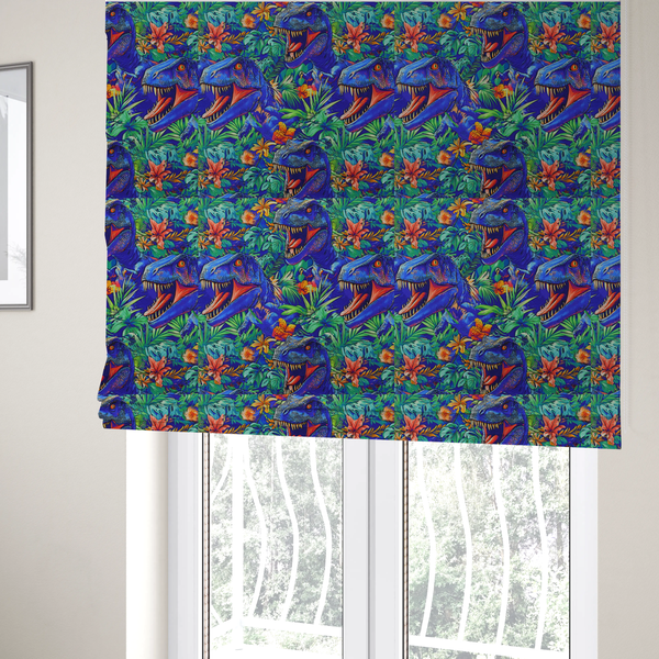 The fabric used to create these Roman blinds is a vibrant, repeating pattern on a rich blue background featuring blue-and-purple Tyrannosaurus rex heads with open jaws and sharp teeth, surrounded by lush green tropical foliage, orange flowers, and plants.