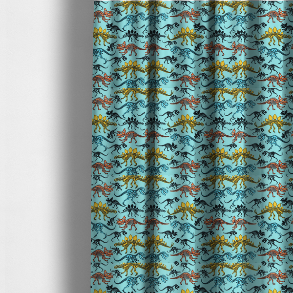 The fabric used to create these made-to-measure curtains is a repeating pattern on a light blue background featuring colourful dinosaur skeletons in yellow, orange, blue, and black, depicting various species including Stegosaurus, Triceratops, and Tyrannosaurus rex.